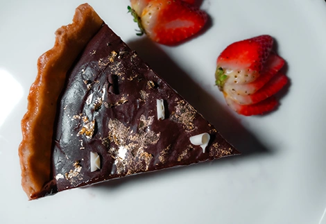 Cookbook food photography of chocolate caramel tart